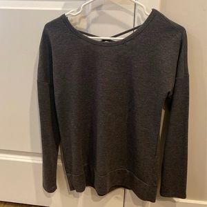 Dark gray sweater with criss cross pattern on back. Looks great with bralette